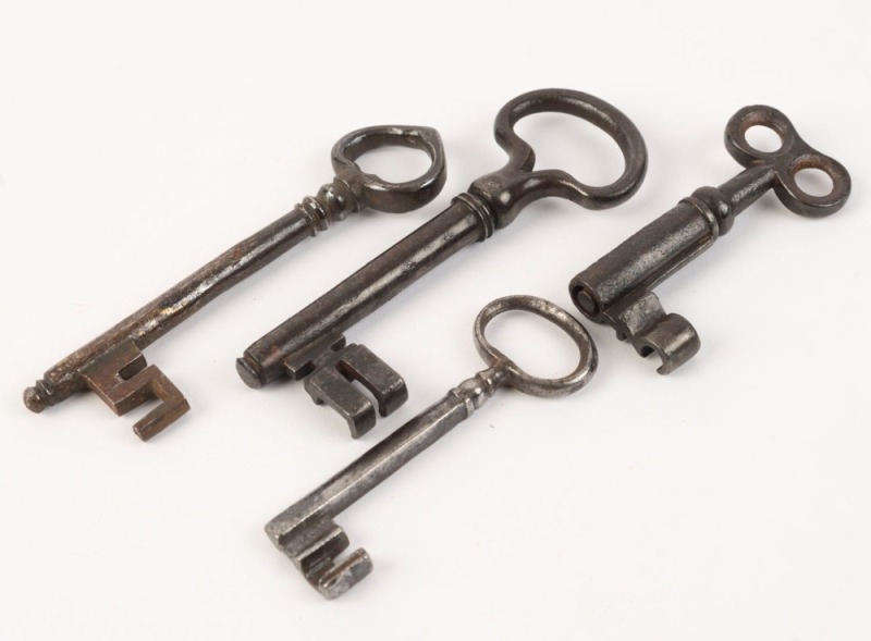 Group of four antique keys, 18th and 19th century, the largest 11cm long