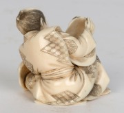A Japanese carved marine ivory statue of the mask maker, 20th century, ​​​​​​​6cm high - 2