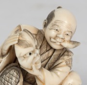 A Japanese carved marine ivory statue of the mask maker, 20th century, ​​​​​​​6cm high - 5