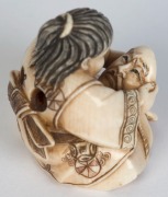 Two Kyoto school Japanese carved ivory netsuke with kabuki masks, 20th century, ​​​​​​​the larger 4cm high - 6