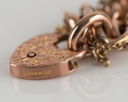 An antique "Day & Night" curb link 9ct yellow gold bracelet in plush box. Made in Birmingham, circa 1904, ​​​​​​​18 grams total - 2