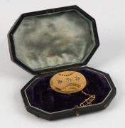 An Aesthetic Movement 18ct yellow gold oval brooch set with three diamonds, housed in a plush fitted box, circa 1870s. Reverse with locket window back. 4cm wide, 14 grams total - 2