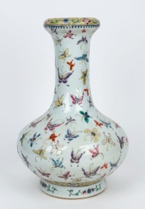 A Chinese bottle shaped porcelain vase decorated with butterflies and floral motif, late Republic period, 20th century, six character iron red Qinglong mark, 36cm high