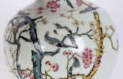 A Chinese bottle shaped porcelain vase decorated with magpies and blossoms, Republic period, 20th century, six character underglaze blue&nbsp;Qinglong&nbsp;mark. Note: A similar example sold at Zacke Auctions Vienna, Sept. 2022, lot 471. 21.5cm high. - 2