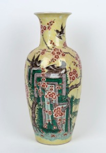 A Chinese famille vert porcelain vase with yellow ground adorned with magpies and blossoms, 20th century, ​​​​​​​leaf mark to base, 45cm high