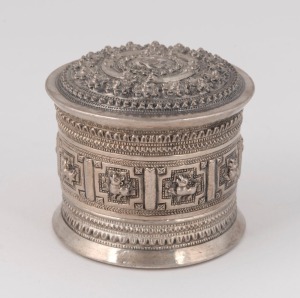 A Burmese coin silver circular box, 20th century, ​​​​​​​6.5cm high, 7cm diameter, 114 grams