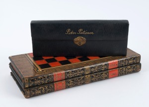 An early 20th century English drafts and backgammon board with playing pieces, along with a leather cased travelling poker set, circa 1920, the chess board 29cm high, 14cm wide 