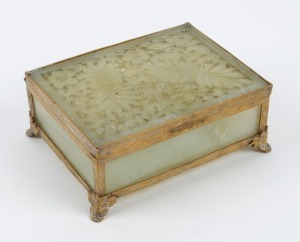 An antique Chinese jade and ormolu framed jewellery box with carved and fretted floral panel, early 20th century, 5cm high, 13cm wide, 10cm deep