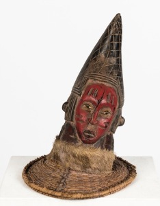 A Baule guardian headdress, carved wood, cane fur and polychrome decoration, Ivory Coast origin, 39cm high