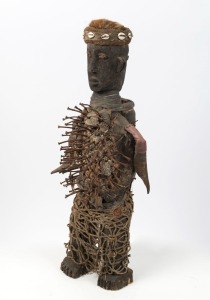 A tribal fetish sculpture, carved wood with nails, shell and fibre, Congo origin, 80cm high