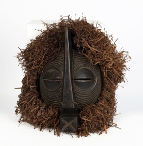 A contemporary tribal Songe mask of carved wood and fibre tassels, ​​​​​​​55cm high