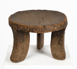 A Turkana three legged stool, carved wood, Northwest Kenya, 23cm high 