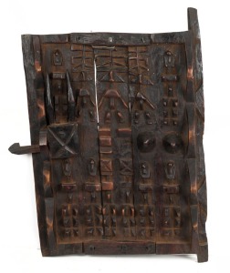 A tribal Dogon granary door, made of carved wood and metal, 54cm long, 50cm wide