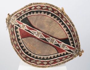 An African tribal shield, made of cane, hide and polychrome pigments, 60cm long