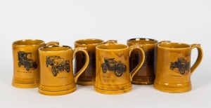 AUTOMOTIVE set of six porcelain tankards, each displaying a vintage car including Benz, Oldsmobile, White Steam Car, Baby Peugeot, Lancaster and Cadillac, made by WADE, 11.5cm high