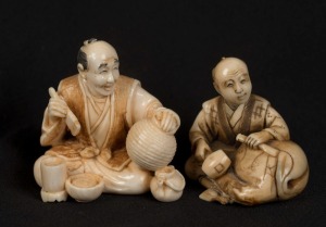 Two Kyoto school Japanese carved ivory netsuke of seated artisans, 20th century, the larger 3.5cm high