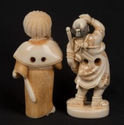 Two Japanese carved ivory netsuke of standing figures with swords, 20th century, ​​​​​​​the larger 5.5cm high - 2