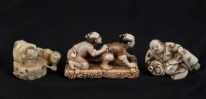 Three Japanese carved ivory netsuke of a reclining man, a drum figural group, and two crouching figures, 20th century, the largest 5cm long