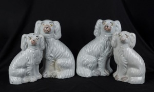 STAFFORDSHIRE group of four assorted antique dog statues, 19th century, ​​​​​​​the largest 26cm high