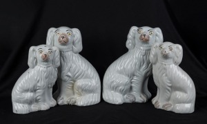 STAFFORDSHIRE group of four assorted antique dog statues, 19th century, the largest 26cm high