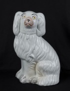 STAFFORDSHIRE group of four assorted antique dog statues, 19th century, ​​​​​​​the largest 26cm high - 2