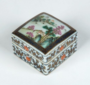 A Chinese porcelain lidded box of square form with hand-painted landscape scene, 20th century, iron red seal mark to base, 5cm high, 6cm wide, 6cm deep