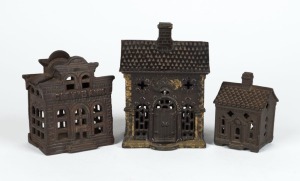 Three assorted antique American cast iron money boxes, 19th century, ​​​​​​​the largest 13.5cm high