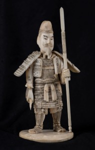 A Japanese carved ivory okimono warrior, Meiji period, 15cm high