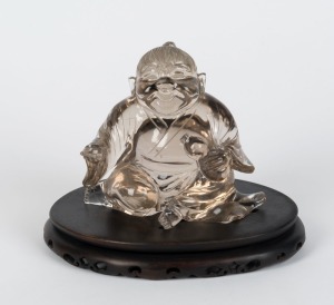 A Chinese carved rock crystal statue on wooden base,  14cm high overall