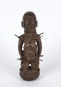 A fetish sculpture, carved wood, nails and fibre, West African origin, 30cm high