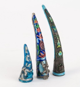 Three assorted Chinese fingernail guards, silver and enamel plus white metal and enamel, 19th and 20th century, the largest 10cm long