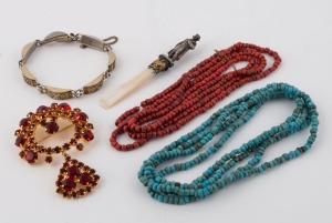 A costume jewellery red stone brooch, a silver finished bracelet, a Napoleon ornament, a Tibetan coral bead necklace and a turquoise bead necklace, (5 items), ​​​​​​​the necklaces 115cm long