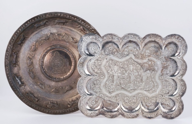 Two Eastern silver finished trays, 20th century, 30cm wide and 29.5cm diameter