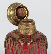 An antique French ruby glass scent bottle with gilt metal mounts and enamel portrait top, 19th century,  8.5cm high - 3
