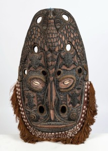 A gable mask, carved wood, shell, earth pigments and fibre, Papua New Guinea, ​​​​​​​85cm high