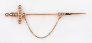 ARONSON & Co. of Melbourne, 9ct yellow sword jabot brooch, set with seed pearls, 19th century, stamped "9" flanked by pictorial marks, 8cm wide, 2.5 grams