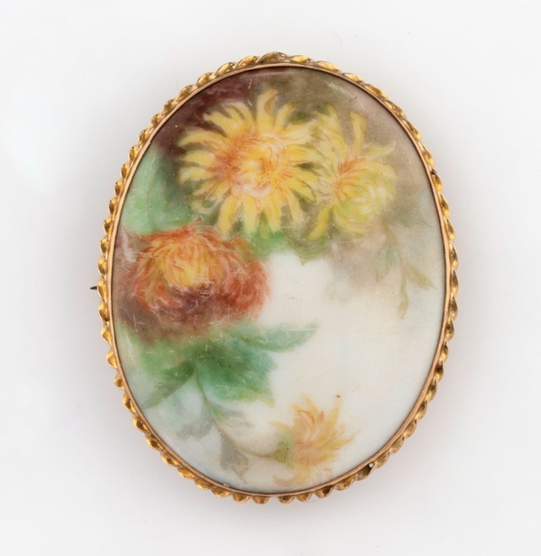 A 9ct gold mounted oval miniature floral painting on porcelain, signed F. BURGESS, early 20th century, ​​​​​​​5.5cm high