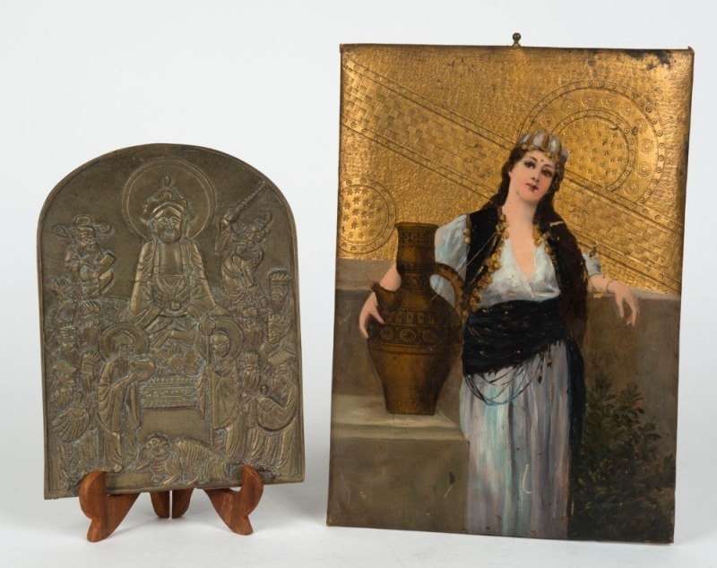 A Buddhist bronze prayer plaque, together with a painting of Rebecca at the well done on a leather photo album board, (2 items), ​​​​​​​ the larger 28 x 20cm