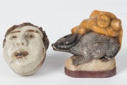 A Chinese carved wooden lion statue, a carved jade basket ornament, a carved stone figural group, a metal seal, and a pottery whistle, (5 items), ​​​​​​​the largest 11cm high - 2