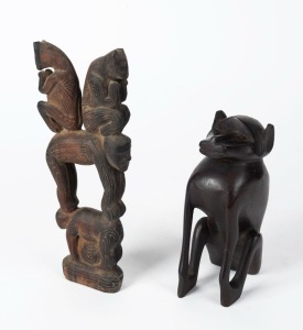 An African carved wooden baboon totem; together with a Papua New Guinean figural carved wooden totem, Milne Bay region, (2 items), ​​​​​​​16cm and 22.5cm high