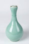 Two Chinese porcelain bottle vases with lotus tops, one glazed in blue and white with landscape scene, the other in celadon, 20th century, both bearing Yongzheng marks, ​​​​​​​22cm high - 3
