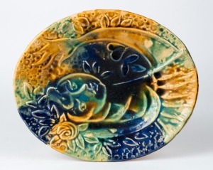 A pottery plaque in the style of MARC CHAGALL, mid 20th century, 33 x 27cm