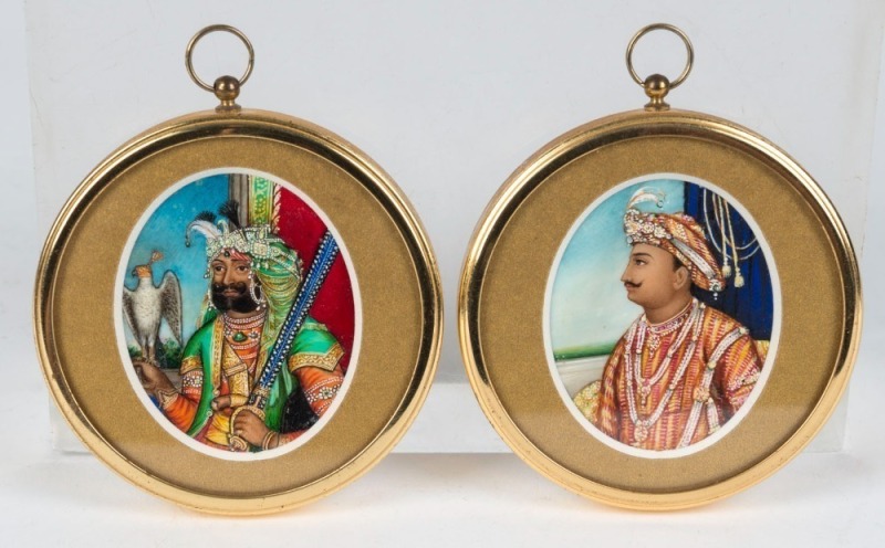 A pair of Indian portrait miniatures on ivory in later frames, 19th/20th century, ​​​​​​​5.5 x 4cm, 7.5cm diameter