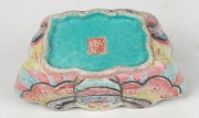 An antique Chinese porcelain dish, a Ming Dynasty blue and white porcelain water pourer, an amber opium bottle and two wooden stands, (5 items), ​​​​​​​the dish 14.5cm wide - 2