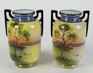 NORITAKE pair of vintage Japanese porcelain vases with hand-painted rural scenes and black finished handles, early 20th century, 13cm high