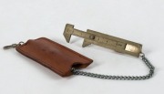 MIKIMOTO&nbsp;pearl calliper in leather pouch, branded "Mikimoto, Tokyo", 8cm long