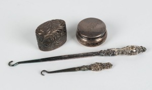 Two sterling silver handled lace hooks, an antique silver ring box, and a sterling silver pill box, 19th and 20th century, (4 items), the larger hook 16cm long