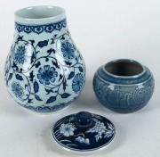 A Chinese moulded blue porcelain vase, Republic period, with Kangxi mark; together with a pair of Chinese blue and white porcelain tea caddies and a lidded vase, (4 items), ​​​​​​​the largest 22cm high - 4
