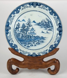 An antique Chinese blue and white porcelain charger on carved wooden stand, early 20th century, ​​​​​​​55cm diameter