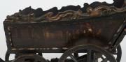 A Dutch folk art carved wood and iron toy cart, beautifully painted with ship portrait of the ZEEHOND (Sea Hound), dated 1781 and town scenes on the sides, 18th century, 30cm high, 39cm long, 18cm wide - 6